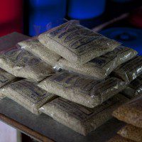 Packets of rice produced by local community members for the Oxfam partner SAKAV. PHOTO: Chris Johnson/OxfamAus