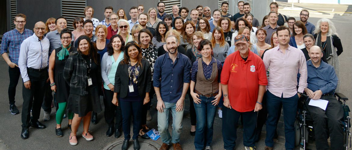 Oxfam Australia staff stand together in a group