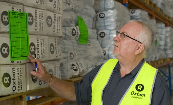 Oxfam Australia Logistics Advisor Graham Kenna checks stock in the new emergency supply chain warehouse in Brisbane. Photo: Ronne Wright/OxfamAUS