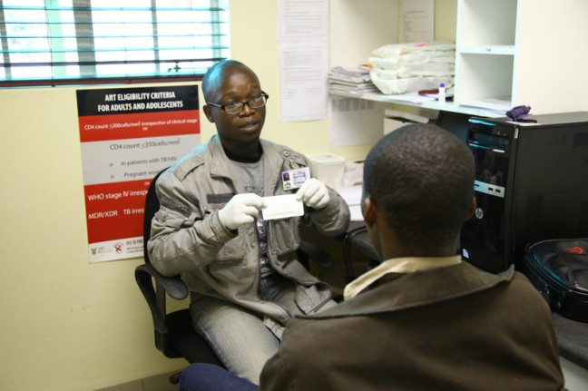 Kwa Zulu Natal, Southern Africa: Mr Phakamani Nguse is seen whilst counselling various teenagers who have come in to the clinic seeking advice on sexual health issues and to be tested for HIV & Aids. Counselling is administered before the HIV test is taken.