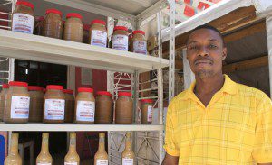 Enock is a supervisor at Fabhris Production, who received a grant from Oxfam. Photo: Jane Beesley/Oxfam