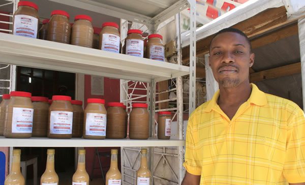 Enock is a supervisor at Fabhris Production, who received a grant from Oxfam. Photo: Jane Beesley/Oxfam