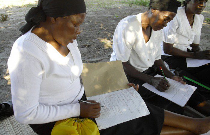 South Africa: Thandiwe Mbhemazi practices her writing at a literacy class which integrates reading, writing and numbers with education around HIV and AIDS. Photo: Cedric Nunn/OxfamAUS Photo: Cedric Nunn/OxfamAUS