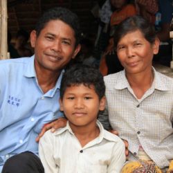 Yuh Met with his wife Hun Vey and his youngest son, Soy Lak. Photo: Dustin Barter/OxfamAUS