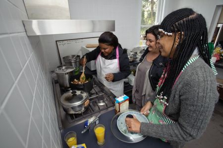 Roseline and Collette cook alongside Oxfam Ambassador Julie Goodwin. Photo: Michael Myers/OxfamAUS Roseline and Collette cook alongside Oxfam Ambassador Julie Goodwin. Photo: Michael Myers/OxfamAUS