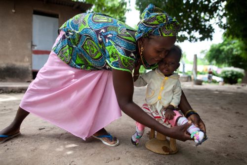 Photo: Holly Pickett/Oxfam A mother cares for her daughter, who is recovering from severe malnutrition in an emergency feeding center run by a Catholic mission. Our programs are aimed at preventing food shortages from becoming health emergencies like this. Photo: Holly Pickett/Oxfam