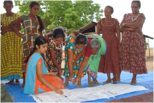 Sri Lankan women debate how to mitigate against the natural hazards in their village. Photo: Irshad Ahamed/OxfamAUS Sri Lankan women debate how to mitigate against the natural hazards in their village. Photo: Irshad Ahamed/OxfamAUS