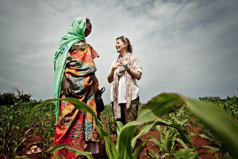 Natasha Stott Despoja with Awa in one of her fields. Photo: Pablo Tosco/Oxfam