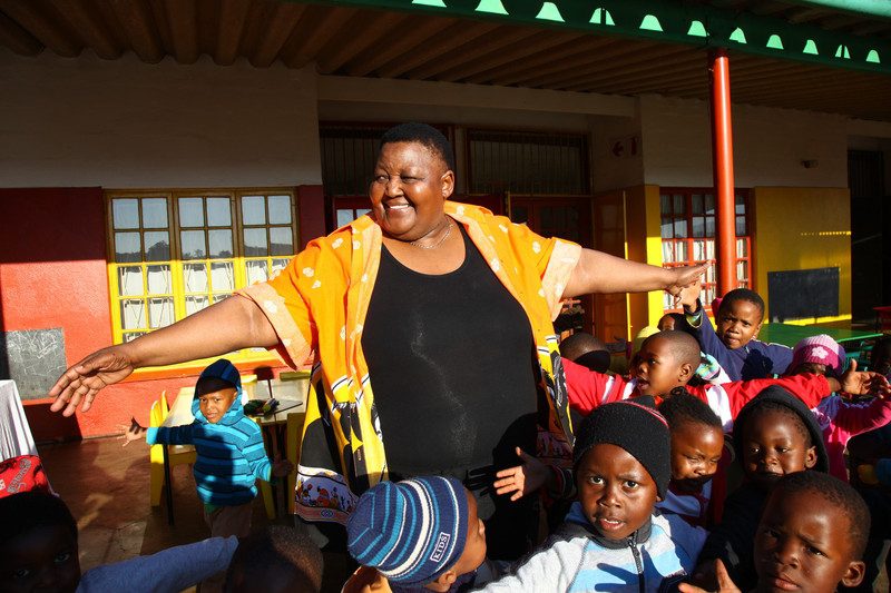 Nokuthula with some of her pupils. Photo: Matthew Willman/OxfamAUS