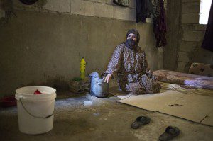 Khadija lives in a bare room in a building that's still under construction