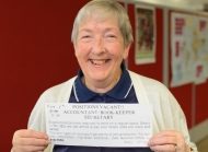 Judy holding the original volunteer ad from 1979. Picture: Lara McKinley