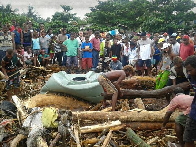 Survivors pick through the debris Solomon Islands flood
