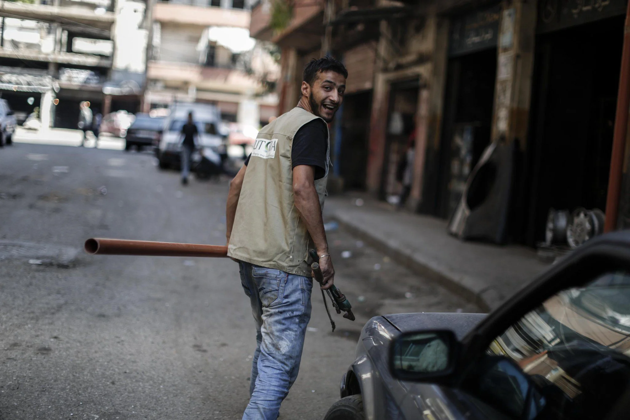 Ahmed is a water engineer for Utopia, an organisation Oxfam partners with in Tripoli, Lebanon. Oxfam and Utopia are collaborating to repair and construct latrines in damaged homes and to install and repair water pipes, tanks and taps to get water flowing again. This work supports both the local population and Syrian refugees in the area. Photo: Sam Tarling