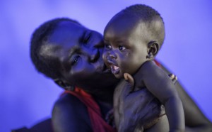 Elizabeth and baby Swampy. Photo: Kieran Doherty/Oxfam