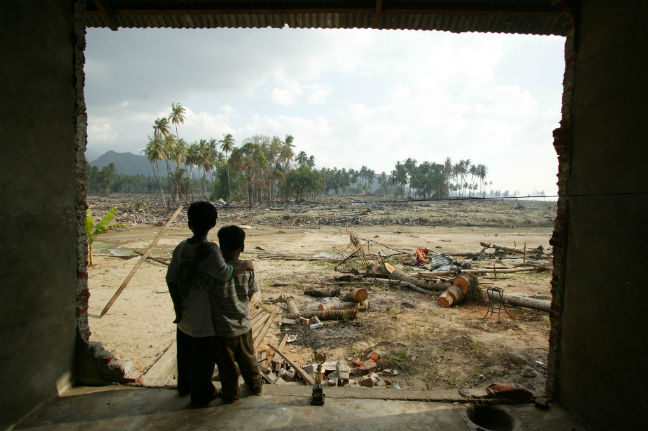 Rahmat and Arie after the wave. Photo: Jim Holmes/Oxfam Photo: Jim Holmes/Oxfam
