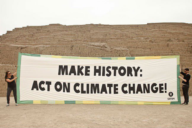Activists unveil a banner at Huaca Pucllana, the site of an ancient pyramid in Lima, Peru ahead of the UN climate conference. Photo: Oxfam Photo: Oxfam
