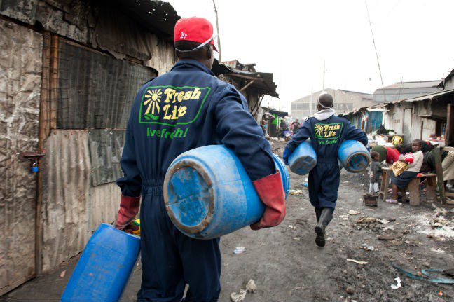 Fresh Life toilet Sanergy workers. Photo: Eleanor Farmer/Oxfam