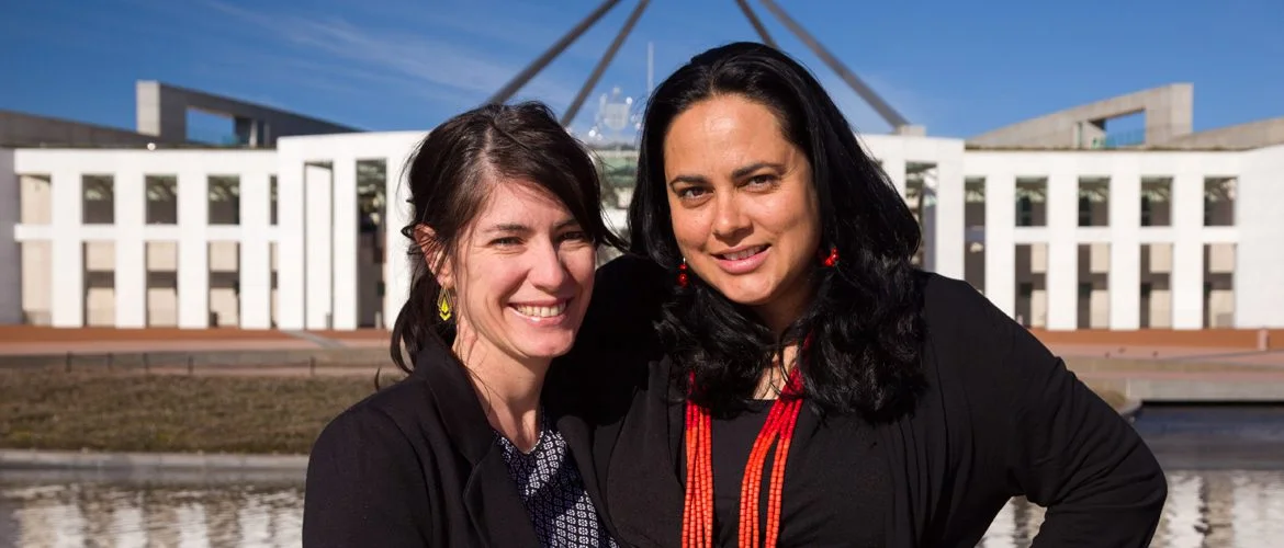 Oxfam Straight Talk Coordinator, Rebecca Harnett (L) and Straight Talk Senior Program Officer, Ngarra Murray (R) stand outside Parliament House for the Straight Talk National Summit 2014. Photo: James Henry/OxfamAUS