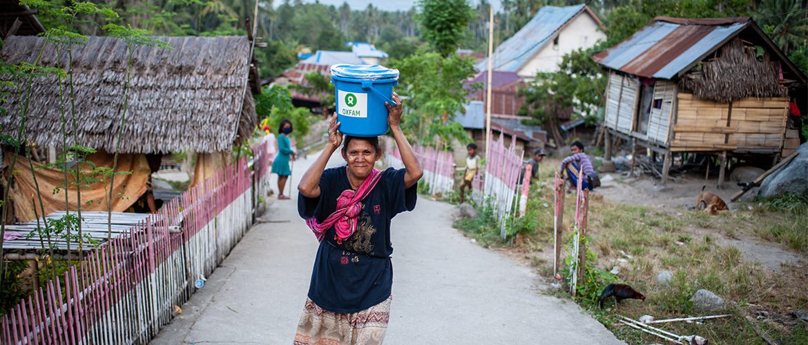 Sulawesi, Indonesia: Sumiar (42) pictured at an Oxfam distribution of hygiene kits outside of Palu.
