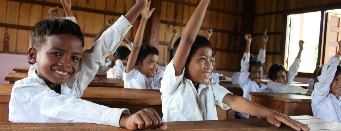 School kids in Tial village raise their hands for Sustainable Development Goals