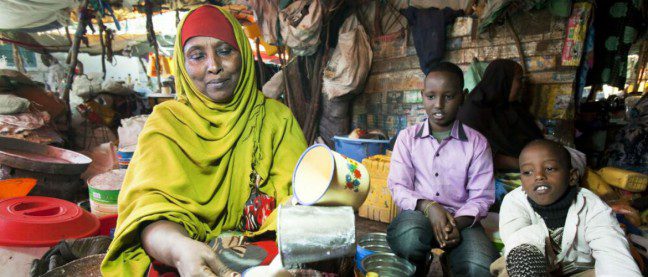 A young boy waits for a fresh cup of Somali yoghurt made from cow’s milk at the market in Hargeisa, Somaliland. Milk is one of the staple foods in Somalia.