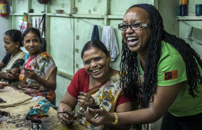 Oxfam Australia staff member Chrisanta Muli learns how to finish the MKS leather products and undertake quality control.