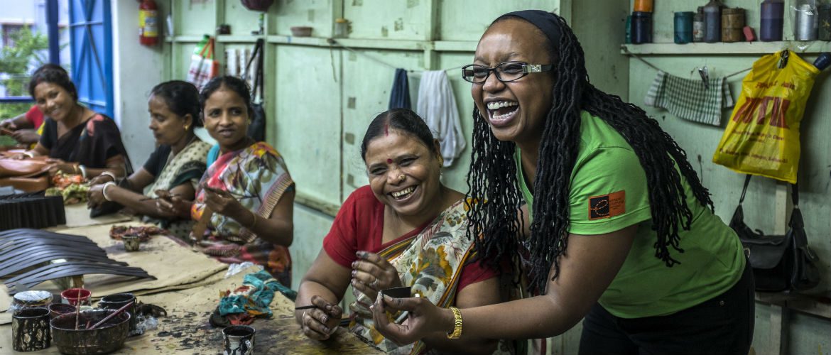 Oxfam Australia staff member Chrisanta Muli learns how to finish the MKS leather products and undertake quality control.