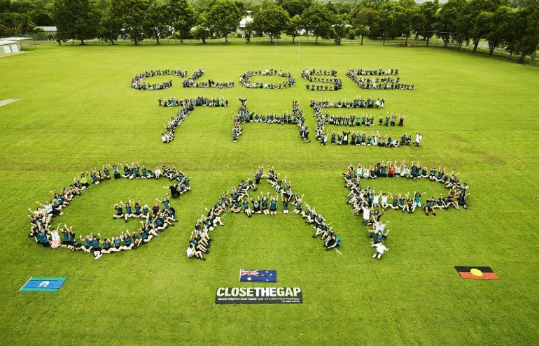 Laidley High School students and Kambu Aboriginal Medical Service. Photo: Jason Malouin/OxfamAUS In 2012, Laidley High School students spelled out Close the Gap with members of Kambu Aboriginal Medical Service (pictured). Photo: Jason Malouin/OxfamAUS.