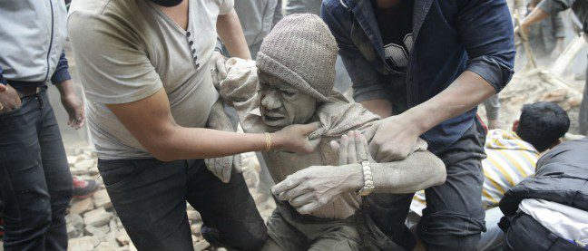 A man is hauled from the rubble in the aftermath of the Nepal earthquake.