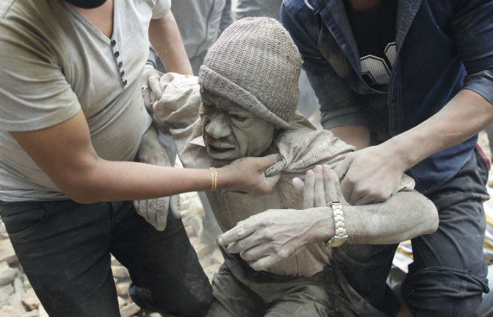 A man is hauled from the rubble in the aftermath of the Nepal earthquake.