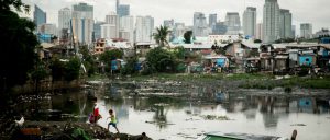 Inequality between the rich and the poor is showcased in this photograph of Tondo slum set against the cityscape of Manila, Philippines, 2014