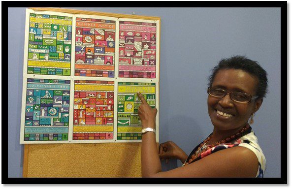 Executive Director of Oxfam International, Winnie Byanyima, with the “Six Goals to Change the World” posters.