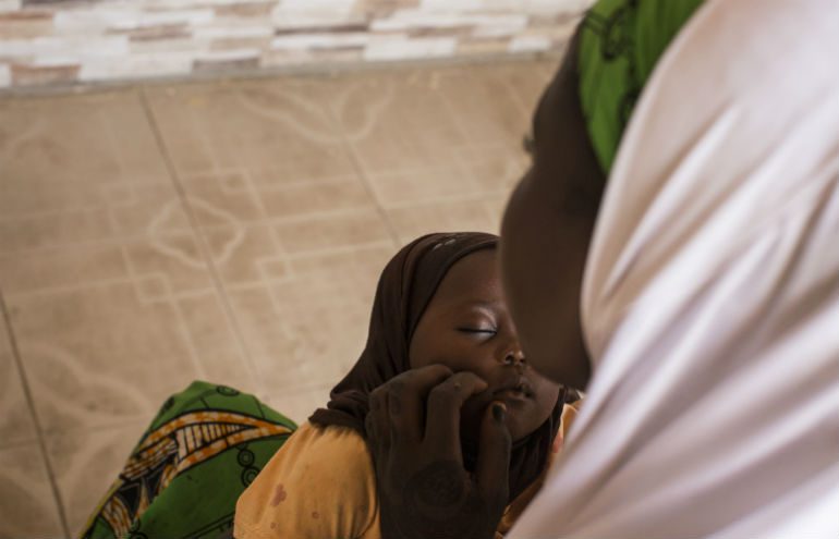 Kadija*, 18, holds her baby at a house in Maiduguri, Nigeria.
Photo: Sam Tarling / Oxfam Photo: Sam Tarling / Oxfam