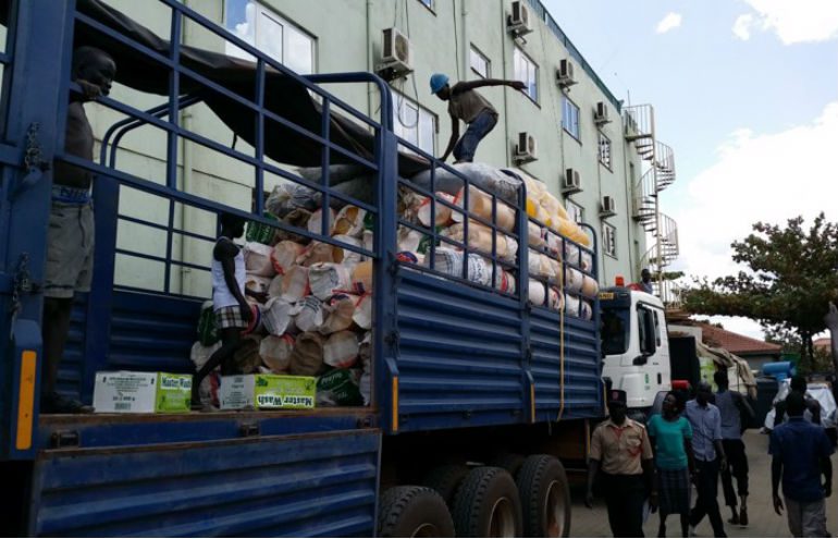 An Oxfam truck is packed dried fish, food and other emergency provisions for distribution to people displaced in South Sudan. Photo: Dylan Quinnell / OxfamAUS Truck loaded with food and aid