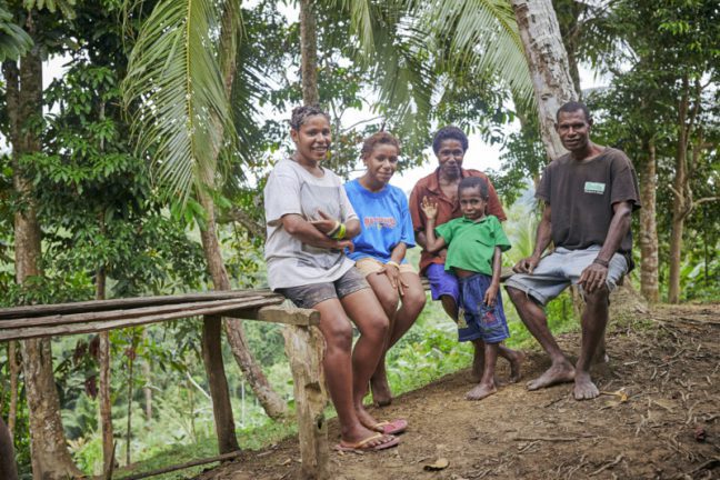 Wewak, Papua New Guinea: Nola sits with her family. Photo: Patrick Moran/OxfamAUS.