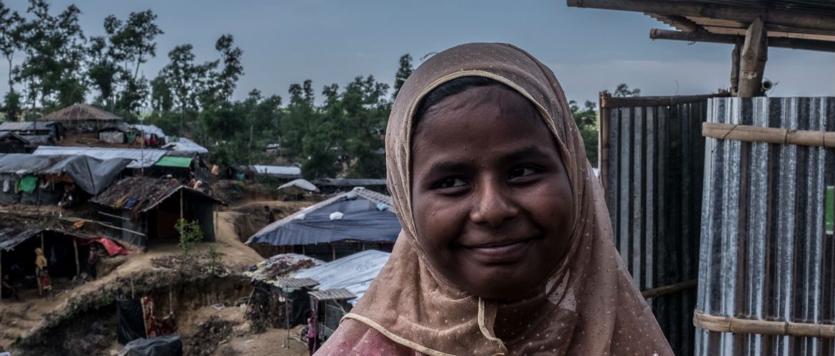 Nur*, 18 stands outside the Oxfam toilet that was installed near where she and her family have set up a home high on a hill in Balukali Camp, Bangladesh