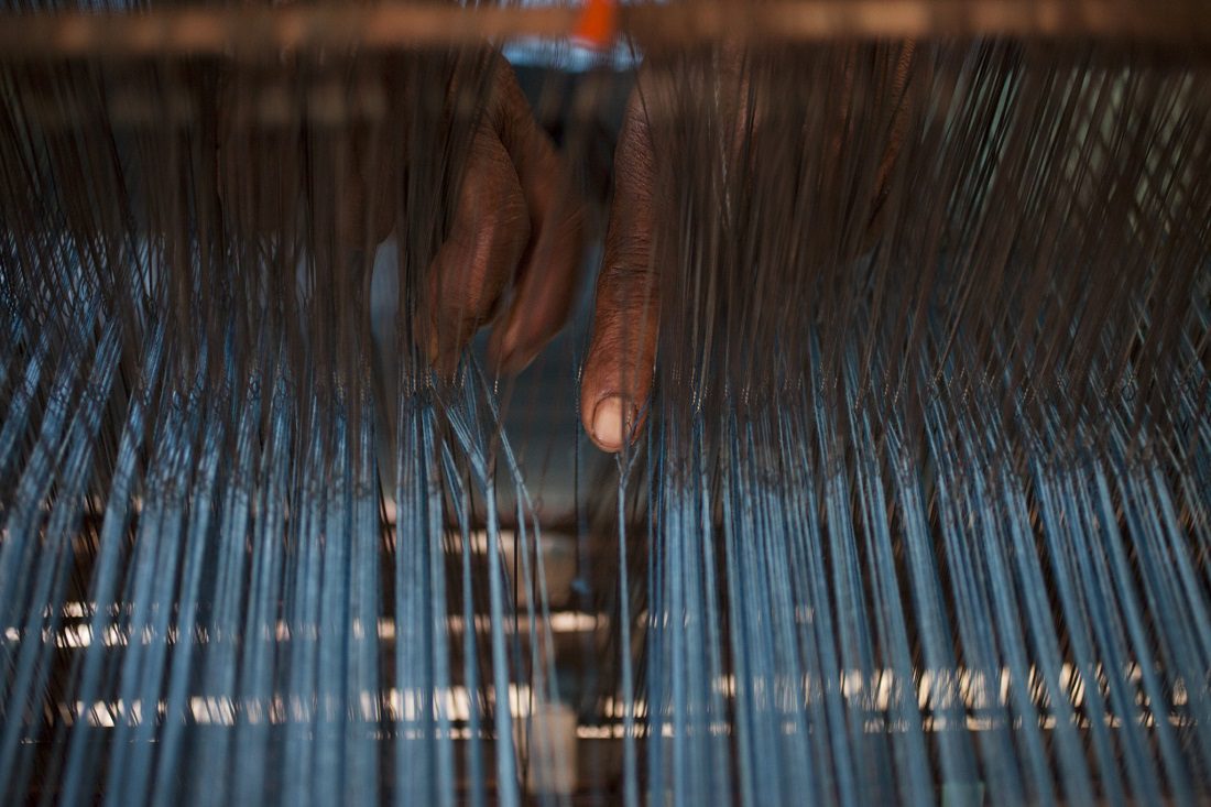 Durga's workshop supplies the beautiful woven cloth that is then screen-printed and sewin into tablecloths made for Oxfam Shop. Photo: Abbie Trayler-Smith/OxfamAUS