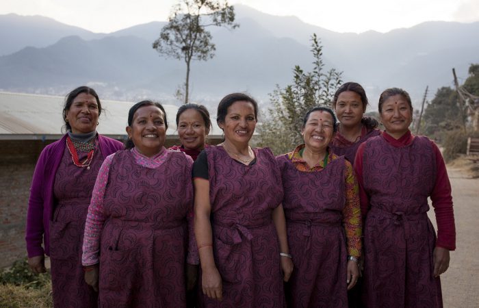 Kathmandu, Nepal: Durga (4th from L), founder and owner of a local weaving business with her employees. Together we're supporting thousands of women like Durga to set up their own businesses in Nepal.