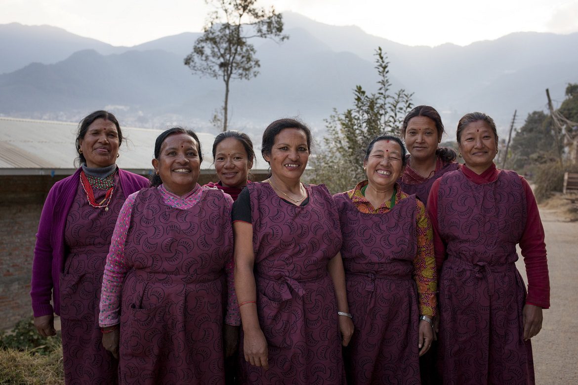 Kathmandu, Nepal: Durga (4th from L), founder and owner of a local weaving business with her employees. Together we're supporting thousands of women like Durga to set up their own businesses in Nepal.