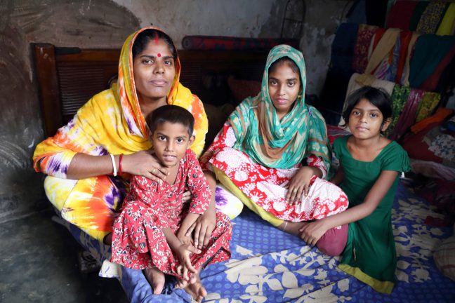 Garment makers with their families