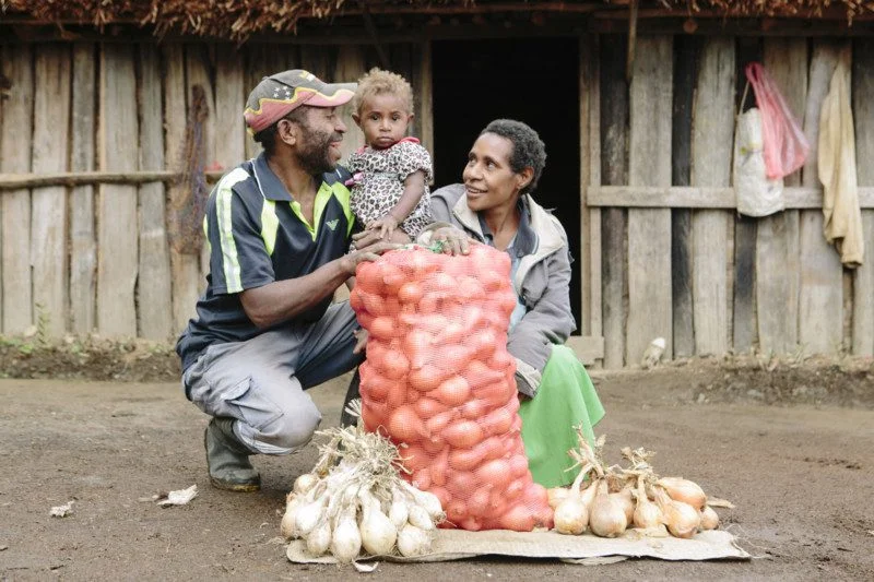 Stephen Bare, with wife Maria Steven and daughter *Ruth with bags of onions ready to sell.