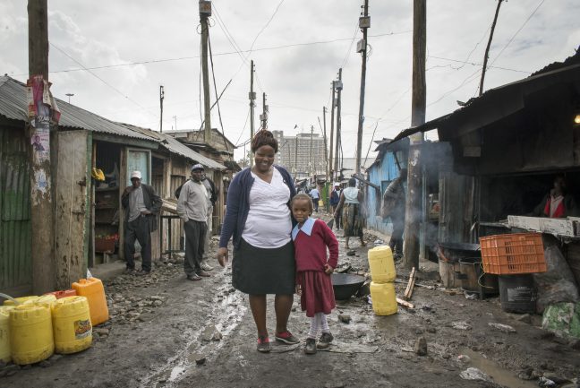 Doreen Muththoni, 38, a small scale trader and her daughter Ruth*, 7, in Mukuru, an informal settlement in Nairobi, Kenya. Photo: Katie G. Nelson/Oxfam Doreen Muththoni, 38, a small scale trader and her daughter Ruth*, 7, in Mukuru, an informal settlement in Nairobi, Kenya. Photo: Katie G. Nelson/Oxfam