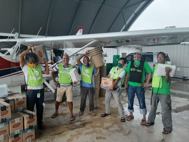 Up and away – Sending 500kg of handwashing kits, soap and posters to the Timorese enclave of Oecusse. Oxfam Staff left to right: Julio Freitas, Joao Corbafo, Jorge Moniz, Domingos Do Rosario, Florentino D. X de Oliveira, Adelino Freitas.Credit: Kathy Richards/Oxfam in Timor-Leste