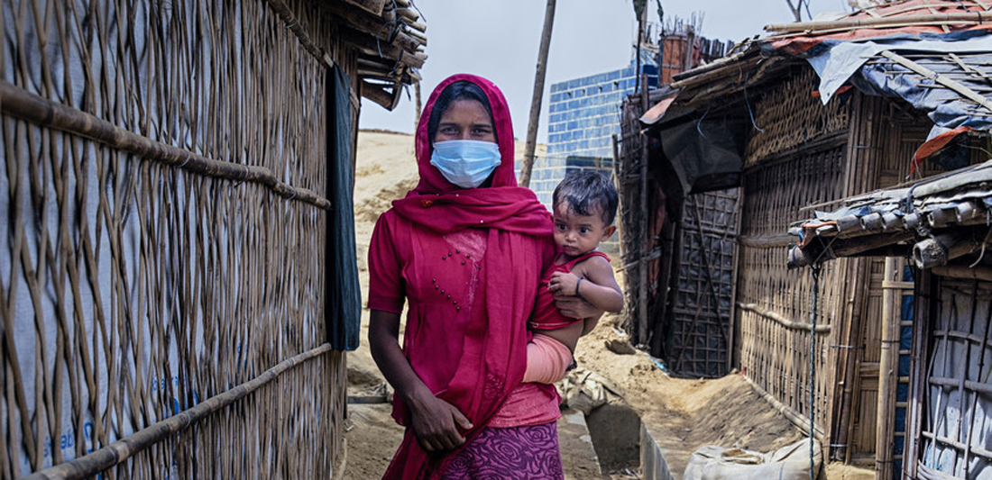 <p>Nur Jahan* with her daughter Ismat* is walking through the narrow alley beside her tent. Rohingya refygee camp. Cox's Bazar, Bangladesh</p>