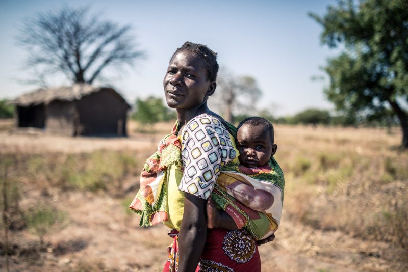 Woman carrying child