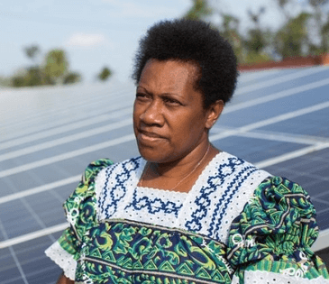 Woman standing in front of solar panels