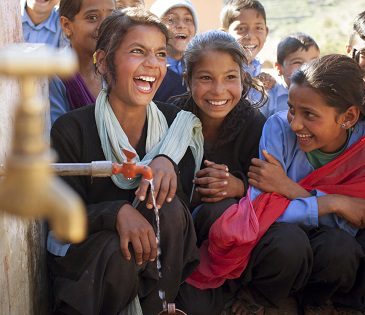 Students by their recently installed tap stand, which was installed by Oxfam at their school in Nepal. Photo: Abbie Trayler-Smith/Oxfam AUS