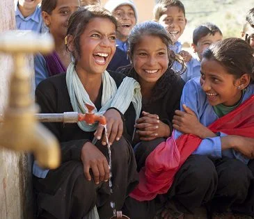 Students by their recently installed tap stand, which was installed by Oxfam at their school in Nepal. Photo: Abbie Trayler-Smith/Oxfam AUS Students by their recently installed tap stand, which was installed by Oxfam at their school in Nepal. Photo: Abbie Trayler-Smith/Oxfam AUS