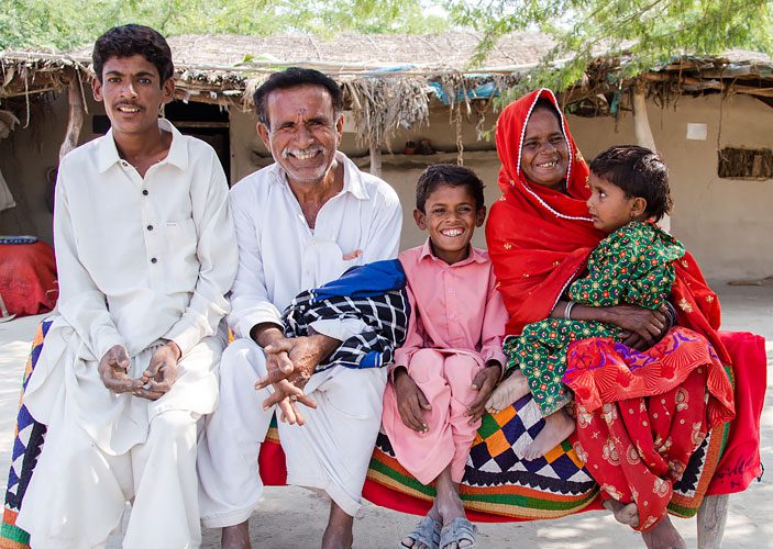Gudi (in red) with her family, Pakistan. Photo: Oxfam in Pakistan Gudi (in red) with her family, Pakistan. Photo: Oxfam in Pakistan