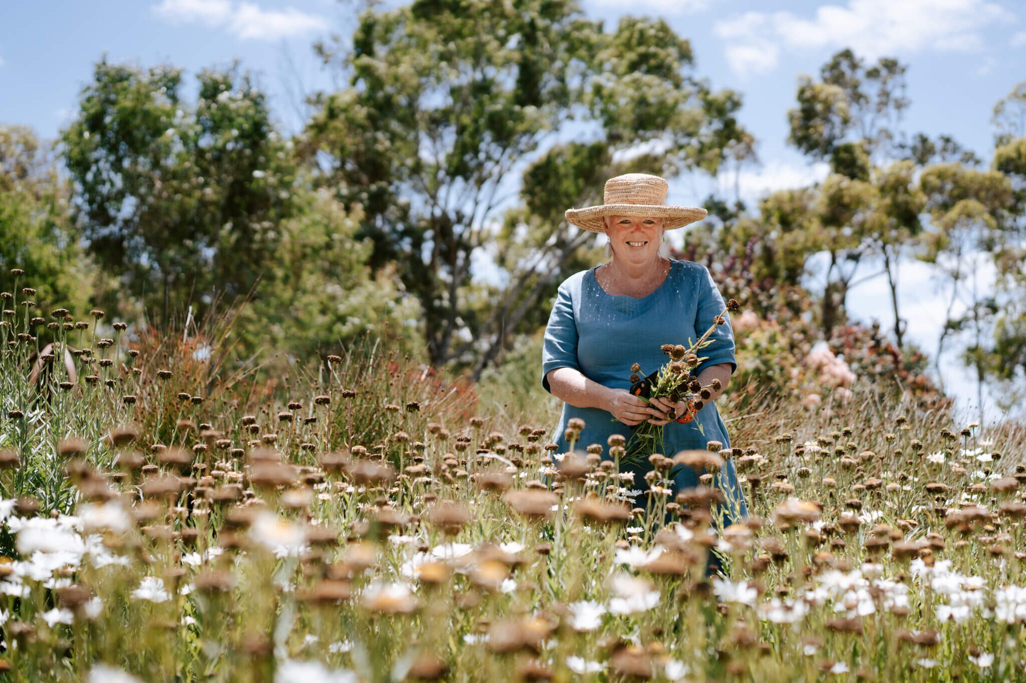 Woman standing in flower field